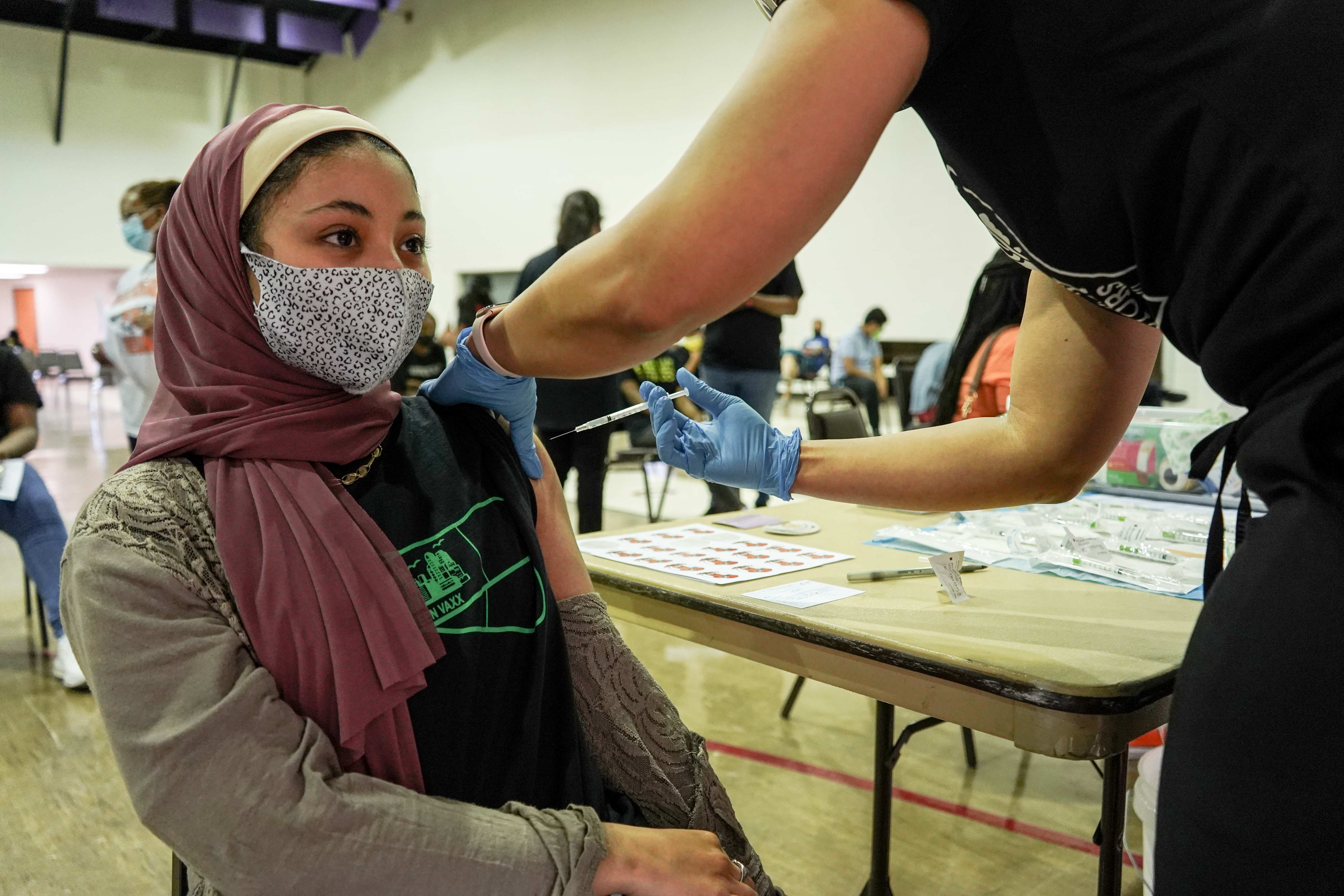 Ibtihal Gassen, a junior at Central High School and a student ambassador with Philly Teen Vaxx, got her first shot at the North Philadelphia clinic on May 15, 2021. (Kenny Cooper/WHYY)