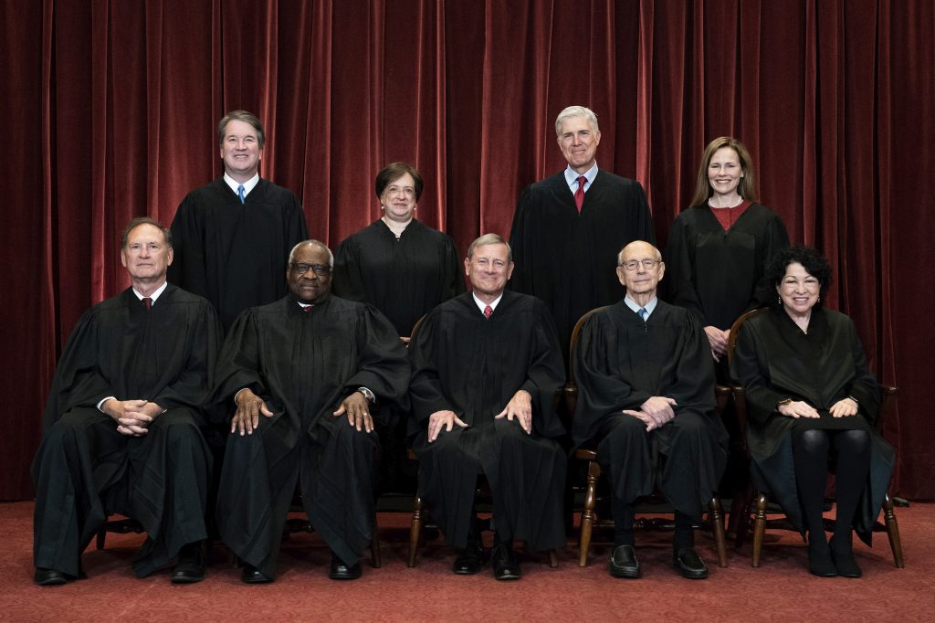 At the center of the case before the Supreme Court was a man whose guns were confiscated from his home. All of the justices decided unanimously and Justice Clarence Thomas, writing for the court, noted the recognition that officers perform many civic tasks is not open-ended. FILE - In this April 23, 2021, file photo members of the Supreme Court pose for a group photo at the Supreme Court in Washington. Seated from left are Associate Justice Samuel Alito, Associate Justice Clarence Thomas, Chief Justice John Roberts, Associate Justice Stephen Breyer and Associate Justice Sonia Sotomayor, Standing from left are Associate Justice Brett Kavanaugh, Associate Justice Elena Kagan, Associate Justice Neil Gorsuch and Associate Justice Amy Coney Barrett. Before the Supreme Court this is week is an argument over whether public schools can discipline students over something they say off-campus. (Erin Schaff/The New York Times via AP, Pool, File)