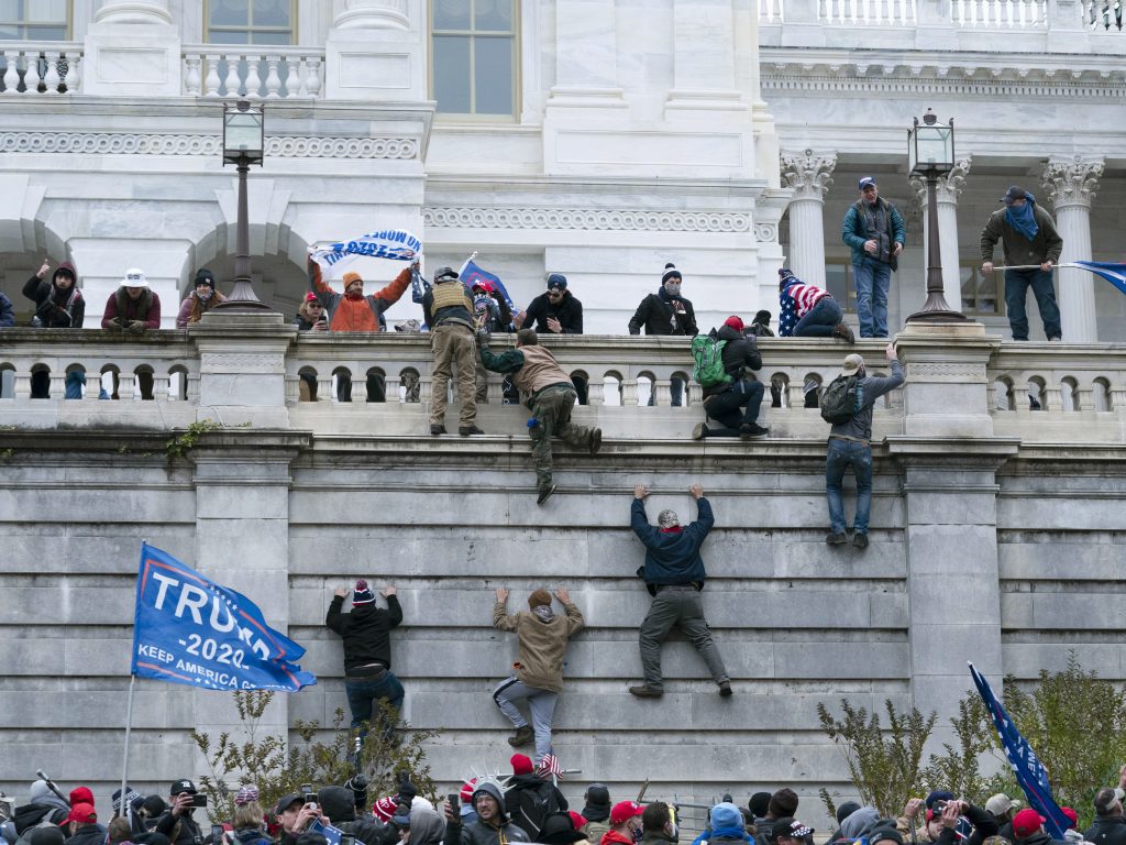 Supporters of President Donald Trump climb the west wall of the the U.S. Capitol on Jan. 6. Supporters of President Donald Trump climb the west wall of the the U.S. Capitol on Jan. 6. (Jose Luis Magana/AP Photo)