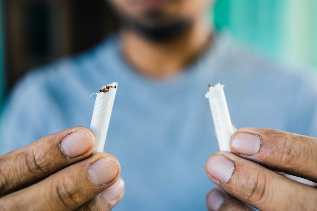 bigstock-Men-Quit-Smoking-Young-Man-Ho-405331055-web Young man holding broken cigarette in hands