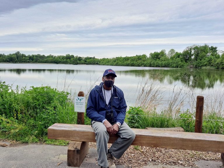 Keith Russell sits on a bench at Fairmount Park