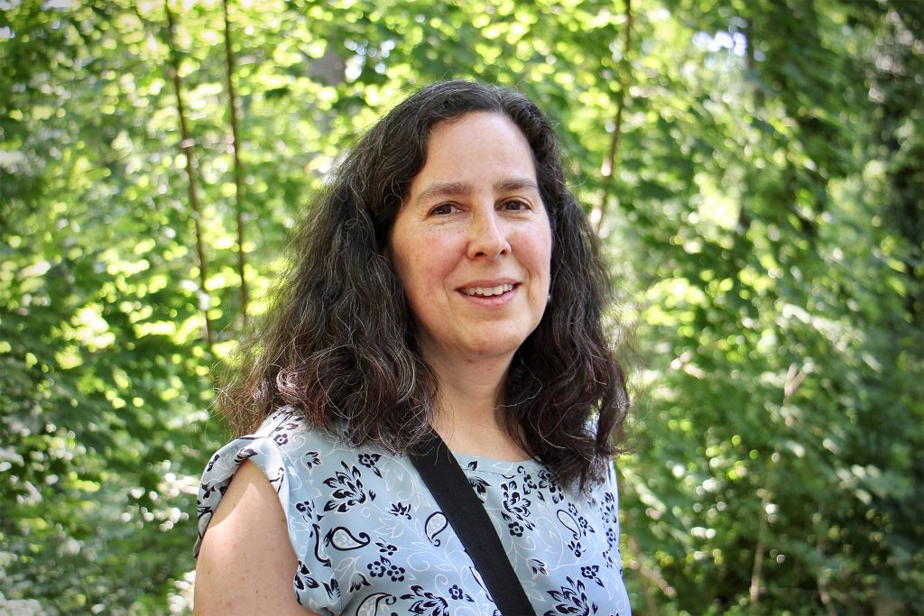 cherylbettigole-healthcommissioner Cheryl Bettigole stands in front of trees outside
