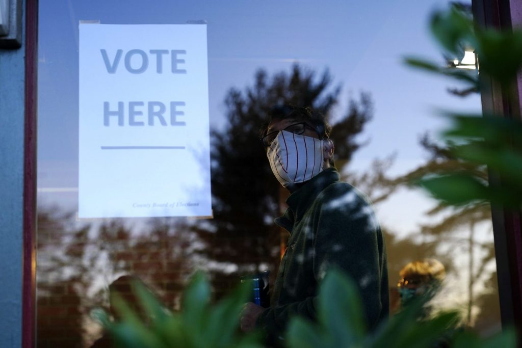 election-2020-pa-4-1920×1280 A voter lines up in a polling place to cast a ballot for the 2020 general election in the United States, Tuesday, Nov. 3, 2020, in Springfield, Pa. (Matt Slocum/AP Photo)