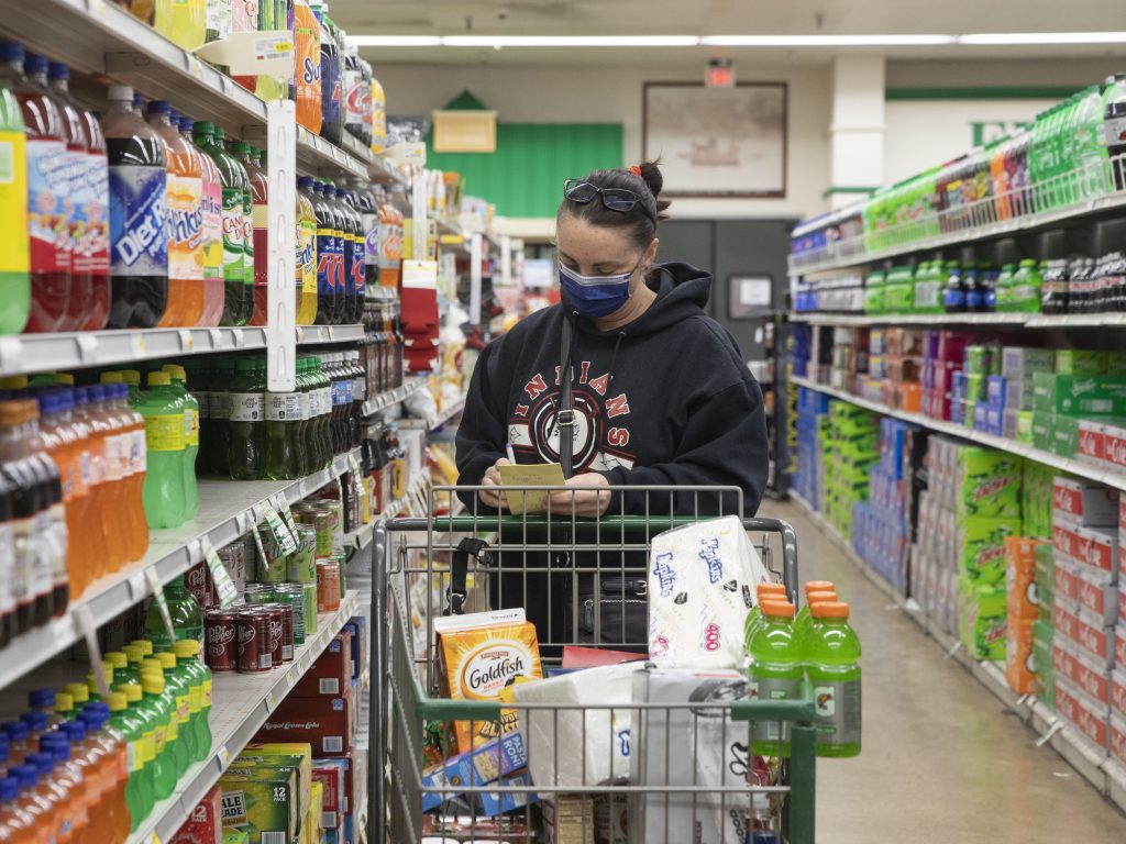 The CDC’s new guidelines on face coverings and social distancing are raising questions about grocery store requirements moving forward. The CDC's new guidelines on face coverings and social distancing are raising questions about grocery store requirements moving forward. (Daniel Acker/Bloomberg via Getty Images)