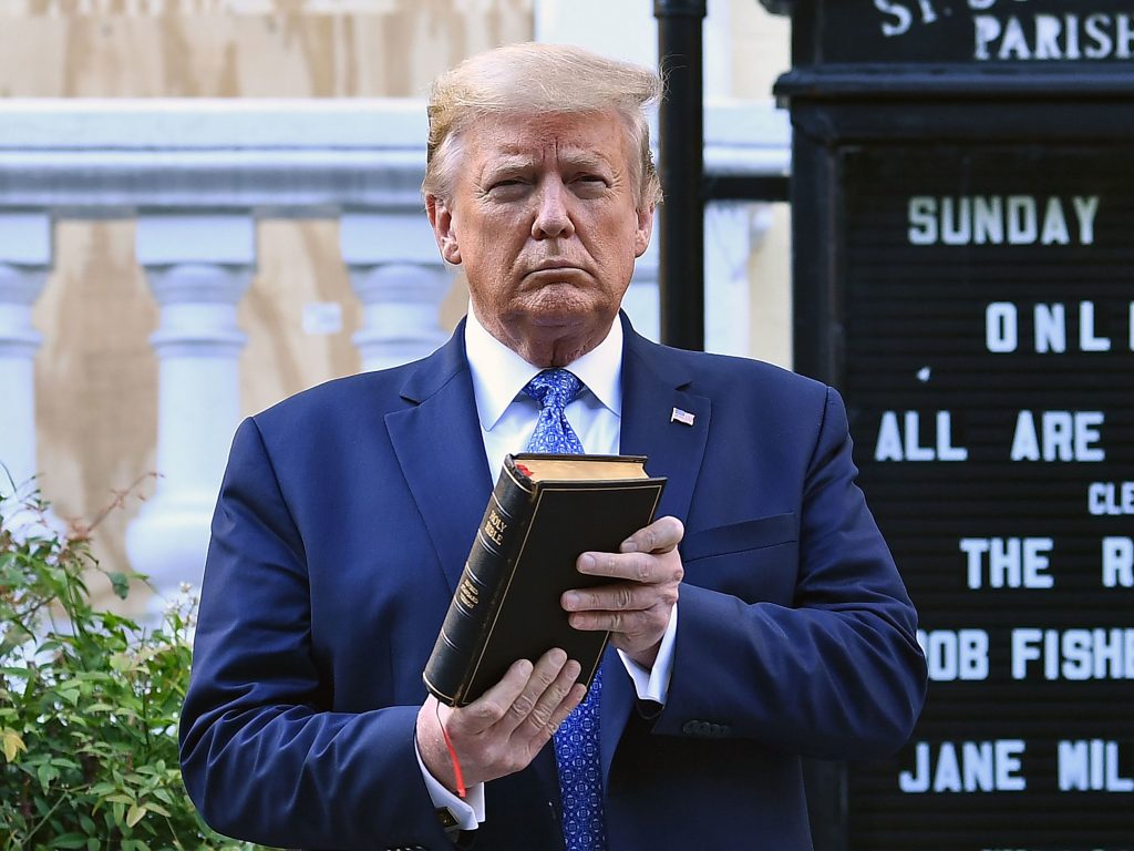 Then-President Trump holds up a Bible outside of St John’s Episcopal Church on June 1, 2020, after days of anti-racism protests against police brutality. President Biden has rescinded several orders Trump made during his last year in office, including moves to protect Confederate statues being dismantled by protesters last year. Then-President Donald Trump holds up a Bible outside St. John's Episcopal Church in Washington, D.C., during a controversial 2020 photo-op.