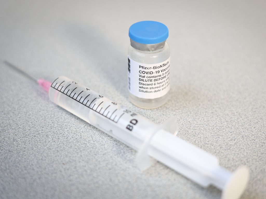 A Pfizer vaccine vial and syringe. A CDC advisory panel has recommended the Pfizer/BioNTech vaccine be administered to adolescents age 12 to 15. A Pfizer vaccine vial and syringe. A CDC advisory panel has recommended the Pfizer/BioNTech vaccine be administered to adolescents age 12 to 15. (Jaap Arriens/NurPhoto via Getty Images)