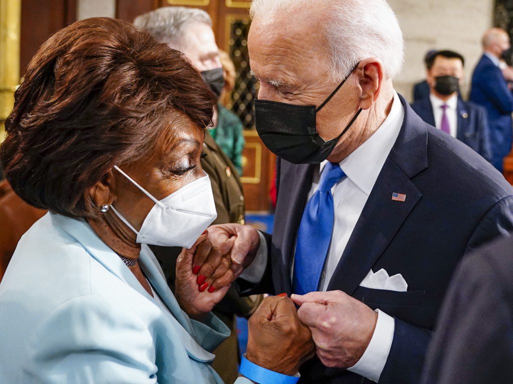 Rep. Maxine Waters fist bumps President Biden at the Capitol on April 28. In an interview with NPR, Waters warns banks she will not be undermined. (Melina Mara/Pool/AFP via Getty Images)