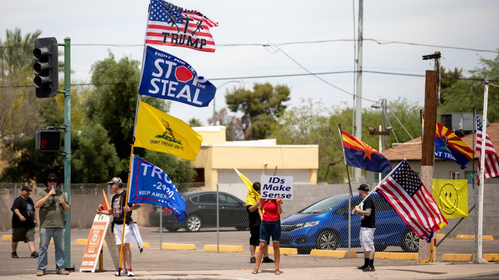 Demonstrators in support of former President Donald Trump gather on May 1 outside the Arizona Veterans Memorial Coliseum in Phoenix, where a controversial 2020 general election review was set to begin. Trump has heartily supported the audit. Demonstrators in support of former President Donald Trump gather on May 1 outside the Arizona Veterans Memorial Coliseum in Phoenix, where a controversial 2020 general election review was set to begin. Trump has heartily supported the audit. (Courtney Pedroza/Getty Images)