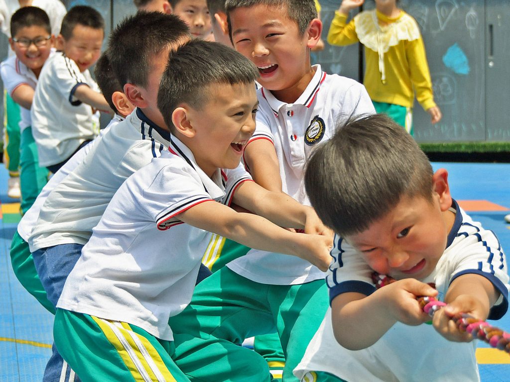 Allowing couples in China to have up to three children rather than two will help the country counteract a population that’s shifting towards the elderly, the government says. Allowing couples in China to have up to three children rather than two will help the country counteract a population that's shifting towards the elderly, the government says. (STR/AFP via Getty Images)