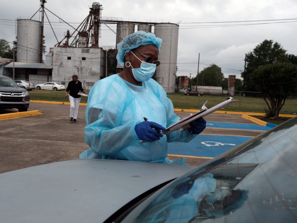 Medical workers with Delta Health Center prepare to vaccinate people in Leland, Miss., last week.