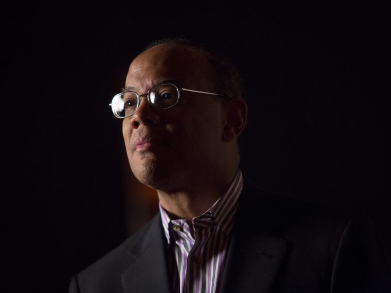John Rogers, co-CEO of Ariel Investments, stands for a Bloomberg Television spot in Atlantic City, N.J., July 22, 2013. Rogers tells NPR about the emotional and financial impact the Tulsa riots had on his family. (Scott Eells/Bloomberg via Getty Images)