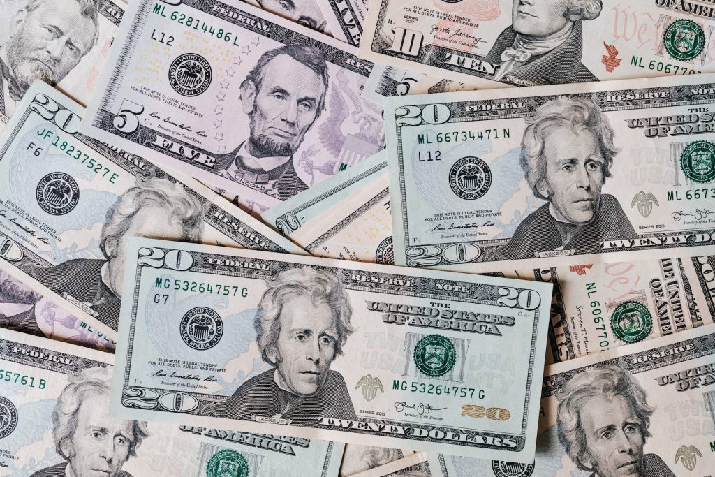 pexels-karolina-grabowska-4386442 Pictures of various dollar bins, including twenties and fives