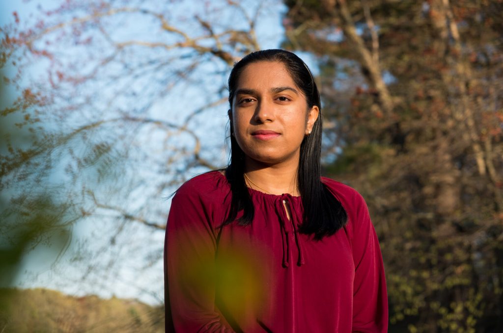 pooja-chandrashekar-10_custom-001aa6e278978f825b748ef71a542e4fc24903f3-s1600-c85 Pooja Chandrasheka poses for a portrait outside in Framingham