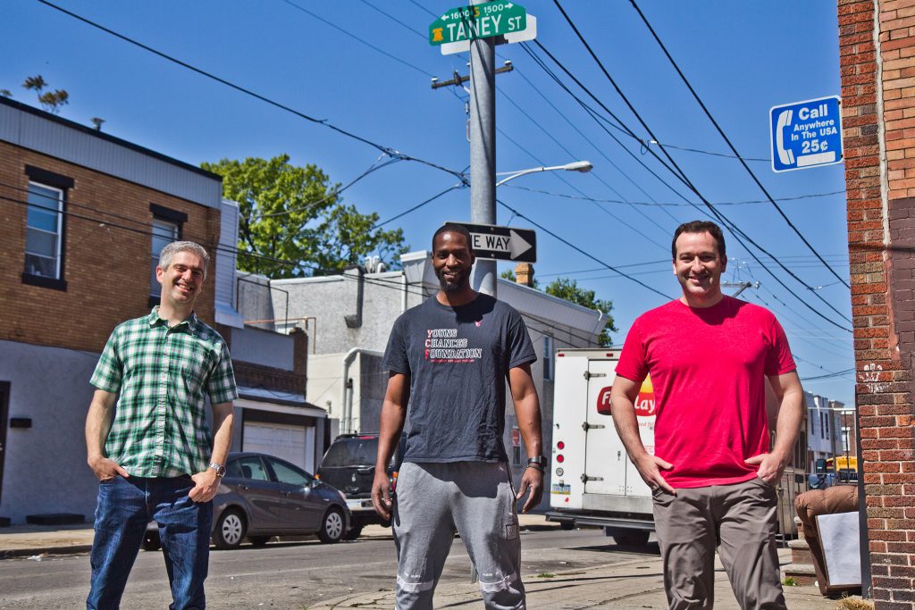 rename-taney-street-02 Ben Keys (left), Tyrique Glasgow (center), and Joshua Isserman (right), stand at the intersection of Tasker and Taney streets