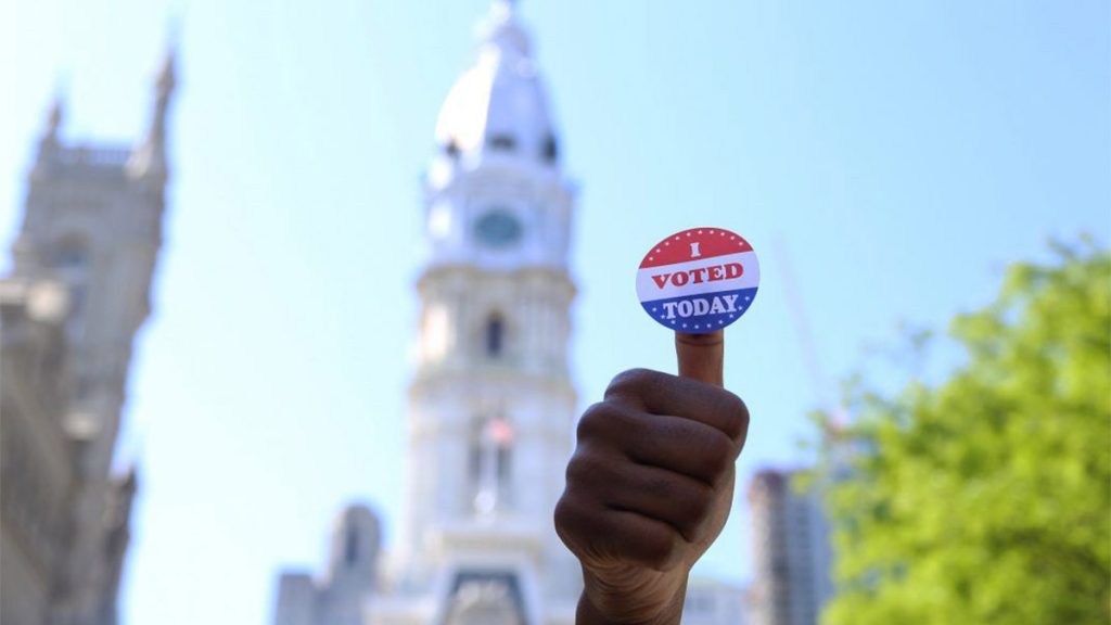voted-phillycityhall A person's hand holds up an