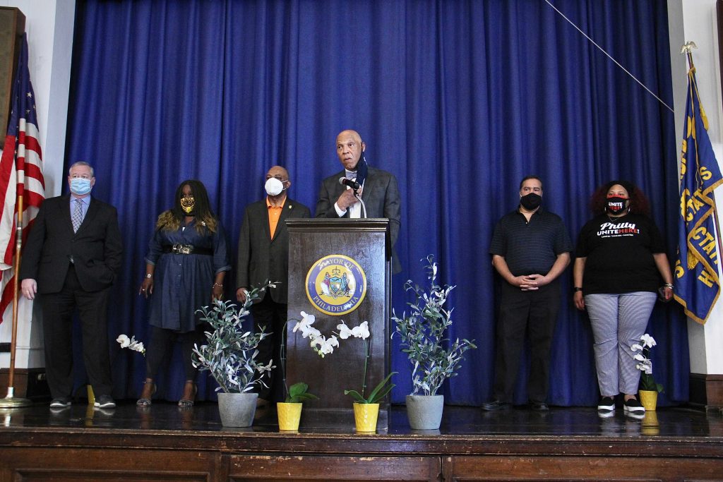 william_hite_SDP_reopening_EL_051921 William Hite speaks from a podium, surrounded by city officials