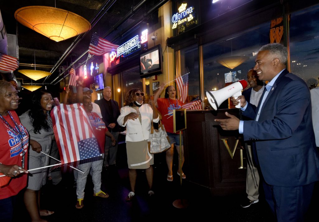 001 On June 8, interim Camden mayor and candidate Vic Carstarphen claims victory in the Democratic primary at Victor Pub in the city amid cheering supporters. (Photo by April Saul for WHYY)