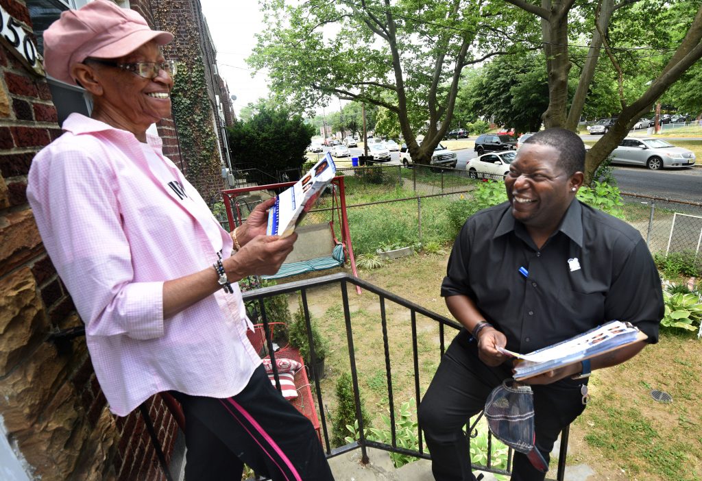 01-5 On May 25, Camden mayoral candidate Elton Custis explains his candidacy to resident Betty Sharp in the Yorkship neighborhood of the city. After speaking to Custis, Clark, a retired social worker, said,