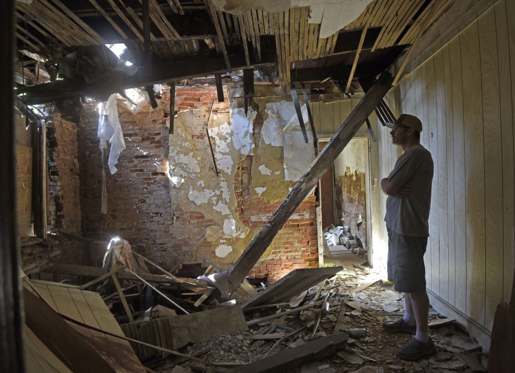 01-8 Patrick Duff, who has been fighting to save the house at 753 Walnut Street in Camden where Martin Luther King lived in 1950, inside the structure on June 10, 2021. (Photo by April Saul for WHYY)