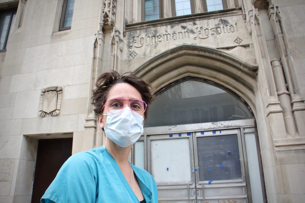 Dr. Shawn Mattson stands outside Hahnemann Hospital on North Broad Street, where she served her residency before the hospital closed in 2019. (Emma Lee/WHYY)