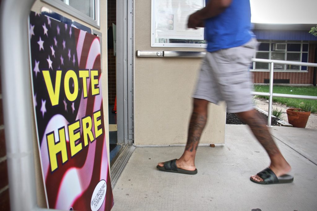 2021 06 08-e lee-willingboro nj-primary election vote here A voter enters the J.C. Stuart Elementary School in Willingboro, N.J., to vote in the primary election. (Emma Lee/WHYY)