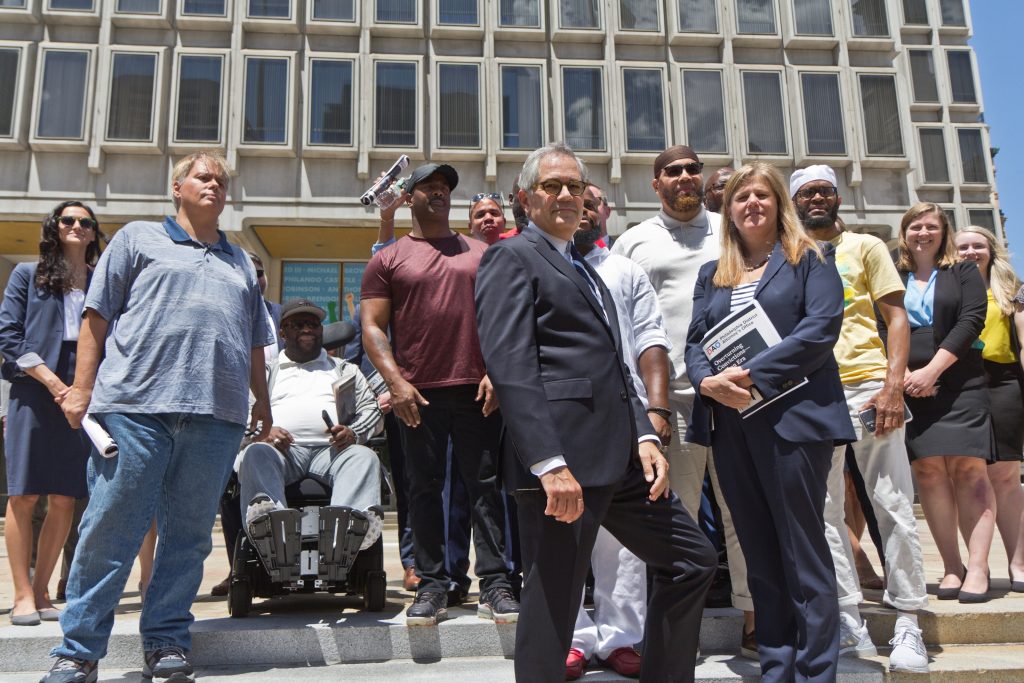 2021-06-15-k-paynter-overturning-convictions-presser-6 Philadelphia District Attorney Larry Krasner, the office’s CIU (Conviction Integrity Unit), and exonerees stood at the site of the statue of former Philadelphia Mayor Frank Rizzo, which was removed from Thomas Paine Plaza last year, calling the release of a report on wrongful convictions in the city on June 15, 2021, “an end of an era.” (Kimberly Paynter/WHYY)