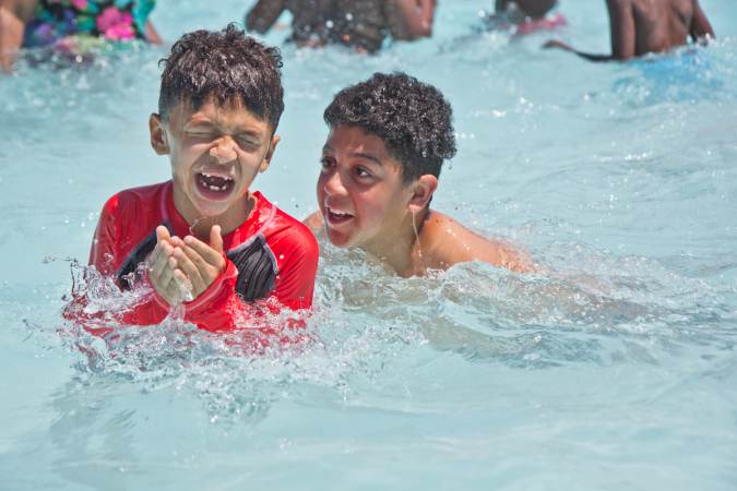Kids swim at the James Finnegan Playground pool