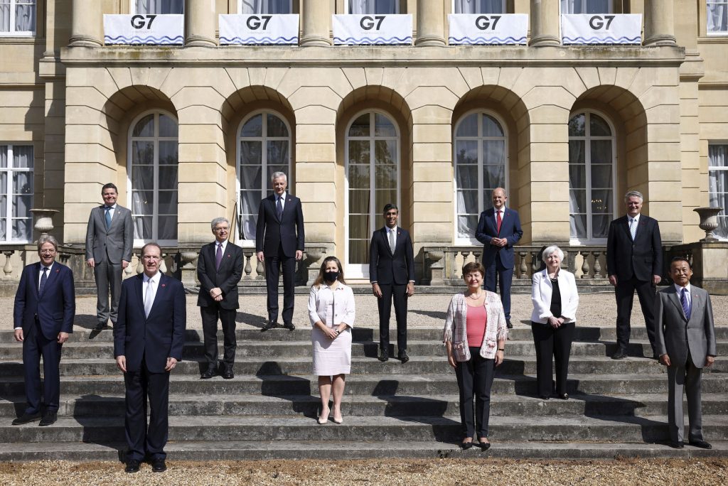 From left, EU's Economy Commissioner Paolo Gentiloni, Eurogroup President Paschal Donohoe, World Bank President David Malpass, Italy's Finance Minister Daniele Franco, French Finance Minister Bruno Le Maire, Canada's Finance Minister Chrystia Freeland, Britain's Chancellor of the Exchequer Chancellor Rishi Sunak, Managing Director of the IMF Kristalina Georgieva, Germany's Finance Minister Olaf Scholz, U.S. Treasury Secretary Janet Yellen, Secretary-General of the Organisation for Economic Co-operation and Development (OECD) Mathias Cormann, Japan's Finance Minister Taro Aso pose for a family photo as finance ministers from across the G7 nations meet at Lancaster House in London, Saturday, June 5, 2021 ahead of the G7 leaders' summit. (Henry Nicholls/Pool Photo via AP)