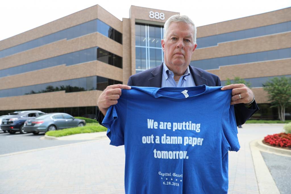 Ray Feldmann Ray Feldmann, who lives blocks away from the Capital Gazette's former office where five people were killed in a 2018 mass shooting, stands in front of the building Monday, June 21, 2021, in Annapolis, Md. He holds a shirt with a quote from Chase Cook, a staffer at the newspaper who is no longer there after taking a recent buyout, who made the comment in a tweet after the attack. Opening statements in the second phase of the gunman's trial to determine whether he is criminally responsible due to mental illness are scheduled for Tuesday, June 29. Jarrod Ramos already has pleaded guilty to all 23 counts against him. (AP Photo/Brian Witte)