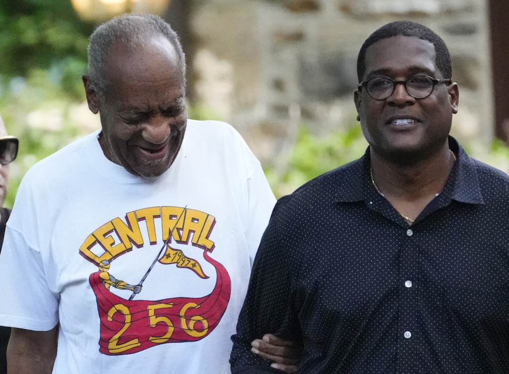 Bill Cosby Comedian Bill Cosby, left, and spokesperson Andrew Wyatt approach members of the media gathered outside the home of the entertainer in Elkins Park, Pa., Wednesday, June 30, 2021. (AP Photo/Matt Slocum)