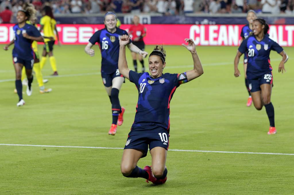 Carli Lloyd Carli Lloyd slides on astro turf during a soccer game
