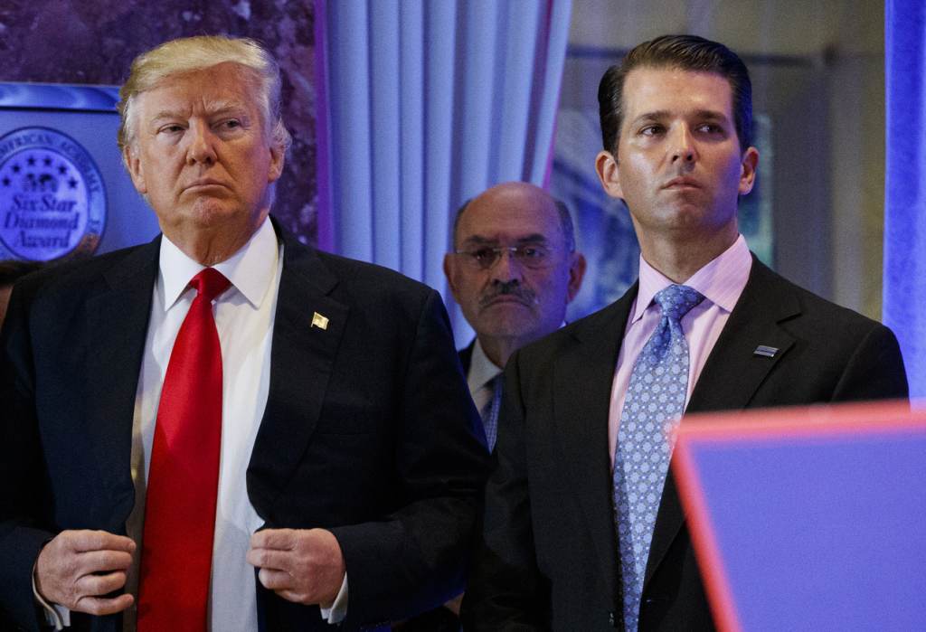 Donald Trump Donald Trump stands next to his son Don Jr.