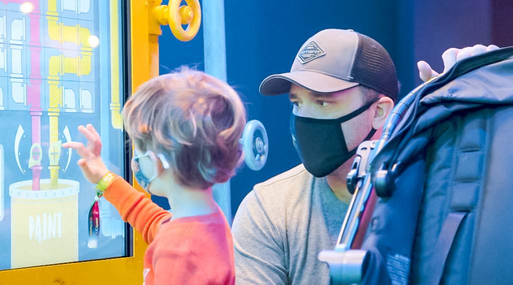 Crayola-1-YOK A father and son looking at an interactive screen at the Franklin Institute in Philadelphia