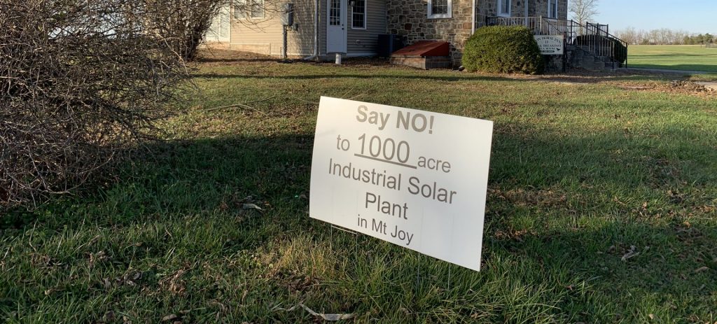 IMG_0166-e1608593764814-1920×868 One of the many signs protesting a proposed solar project in Mount Joy Township, Adams County is seen here in front of the Iron Horse Inn on Nov. 24, 2020. Owner Tom Newhart said the project could hurt the tourism industry in the area, just outside Gettysburg. (Rachel McDevitt / StateImpact Pennsylvania)