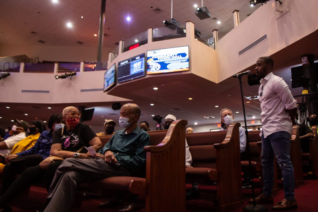 IMG_5845 Walnut Hill resident Shuja Moore offered the idea of reaching out to Philadelphia’s biggest influencers to help combat the city’s gun violence epidemic at the Philadelphia District Attorney’s Office Community Town Hall at the Church of Christian Compassion in West Philadelphia. (Kimberly Paynter/WHYY)