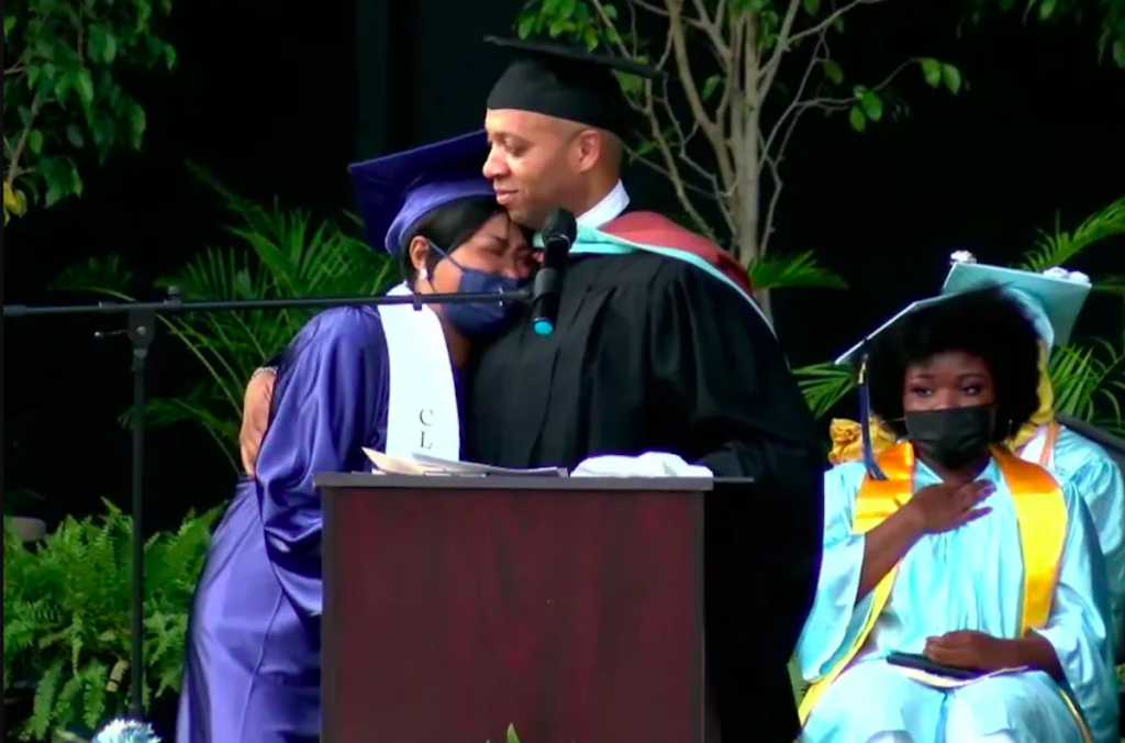 Screen Shot 2021-06-11 at 11.40.47 AM Richard Gordon, principal of Paul Robeson High School, consoles Tawanda Robinson, mother of David Williams, who was gunned down in 2020. Williams was set to graduate this year. (Johann Calhoun / Chalkbeat)