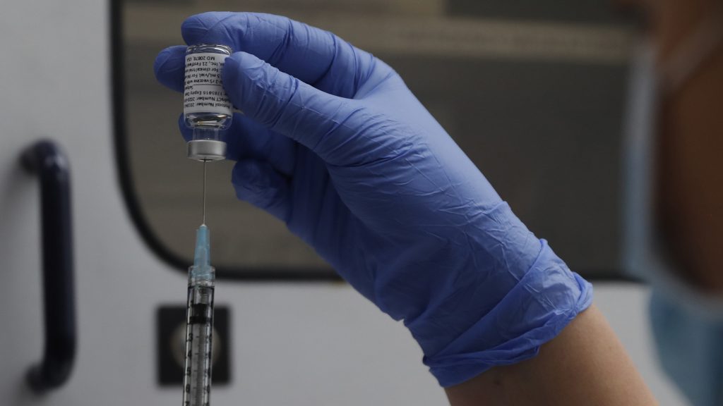 Novavax says its vaccine is 100% effective against the original strain of the coronavirus, and had 93% efficacy against more worrisome variants. A vial of the Phase 3 Novavax coronavirus vaccine is seen ready for use