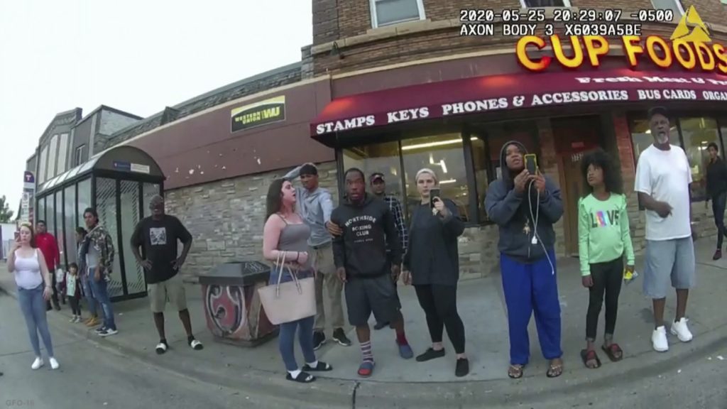 A police body camera image shows bystanders including Darnella Frazier (third from right filming) as former Minneapolis police officer Derek Chauvin was recorded pressing his knee on George Floyd’s neck in Minneapolis. A police body camera image shows bystanders including Darnella Frazier (third from right filming) as former Minneapolis police officer Derek Chauvin was recorded pressing his knee on George Floyd's neck in Minneapolis. (Minneapolis Police Department via AP)