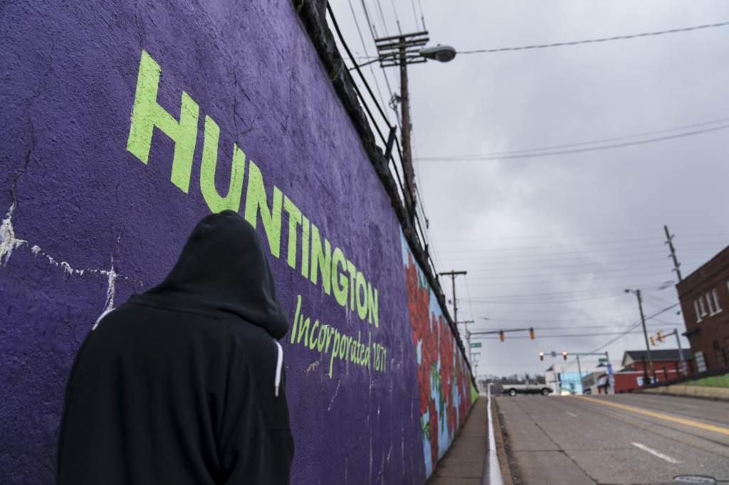 Huntington was once ground-zero for this opioid epidemic. Several years ago, they formed a team that within days visits everyone who overdoses to try to pull them back from the brink. The county’s overdose rate plummeted. They wrestled down an HIV cluster. They finally felt hope. Then the pandemic arrived and it undid much of their effort: overdoses shot up again, so did HIV diagnoses. A pedestrian walks past a mural in Huntington, W.Va., Thursday, March 18, 2021. Huntington was once ground-zero for this opioid epidemic. Several years ago, they formed a team that within days visits everyone who overdoses to try to pull them back from the brink. It was a hard-fought battle, but it worked. The county's overdose rate plummeted. They wrestled down an HIV cluster. They finally felt hope. Then the pandemic arrived and it undid much of their effort: overdoses shot up again, so did HIV diagnoses. (AP Photo/David Goldman)