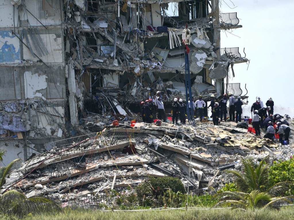 Building Collapse Miami Rescue workers search in the rubble at the Champlain Towers South condominium