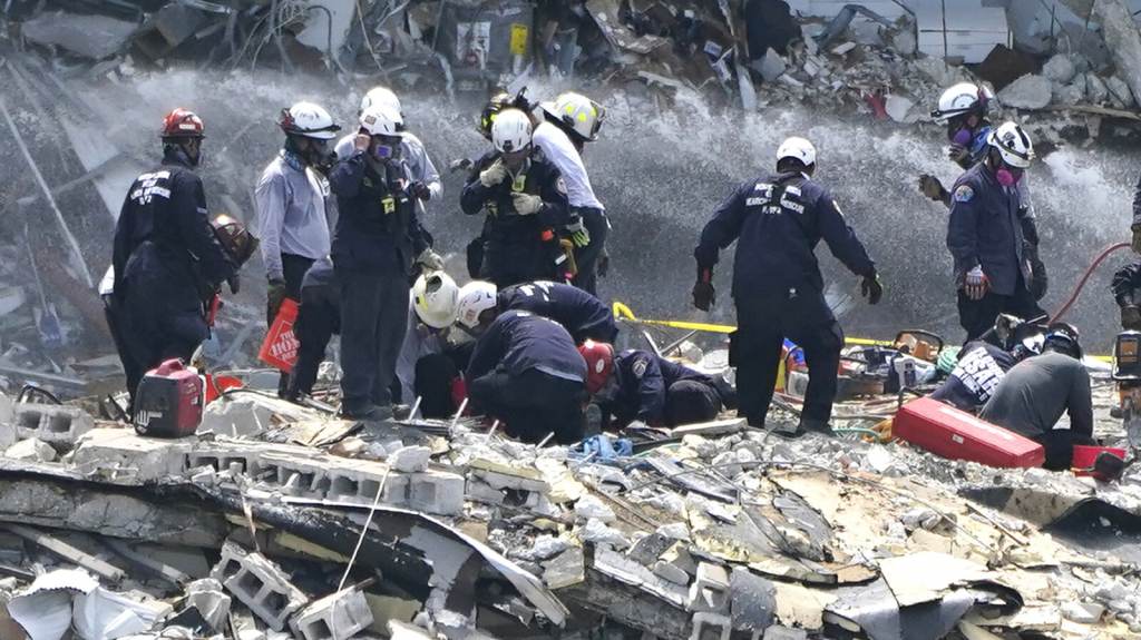 APTOPIX Building Collapse Miami Rescue workers search the rubble of the Champlain Towers South condominium