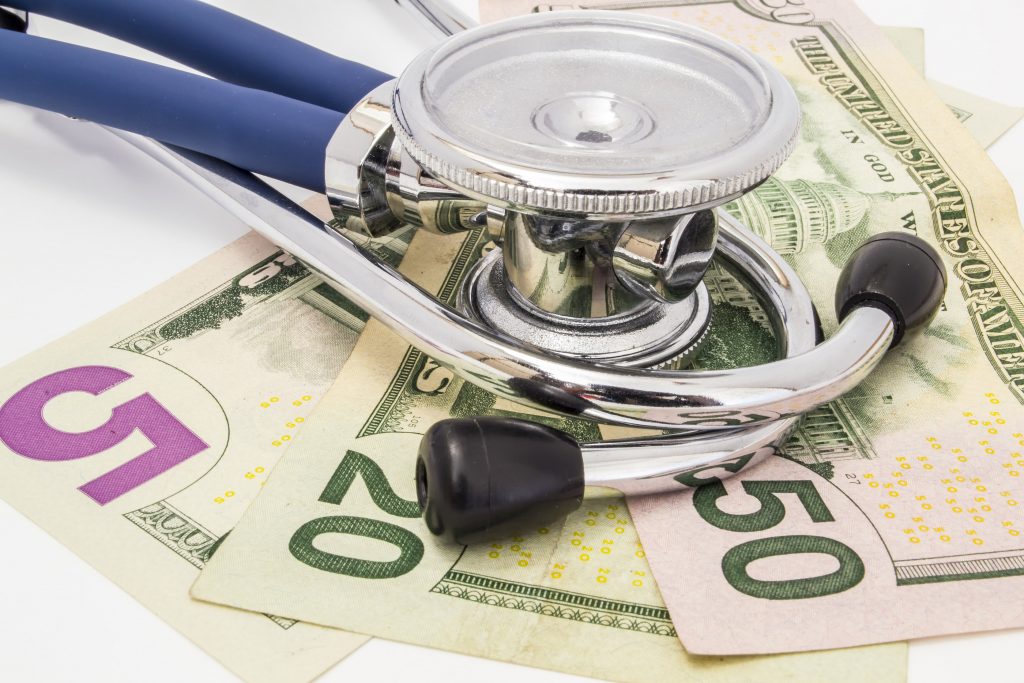 bigstock-Stethoscope-Lying-On-The-Money-290184502-web Save Download Preview Stethoscope lying on the money