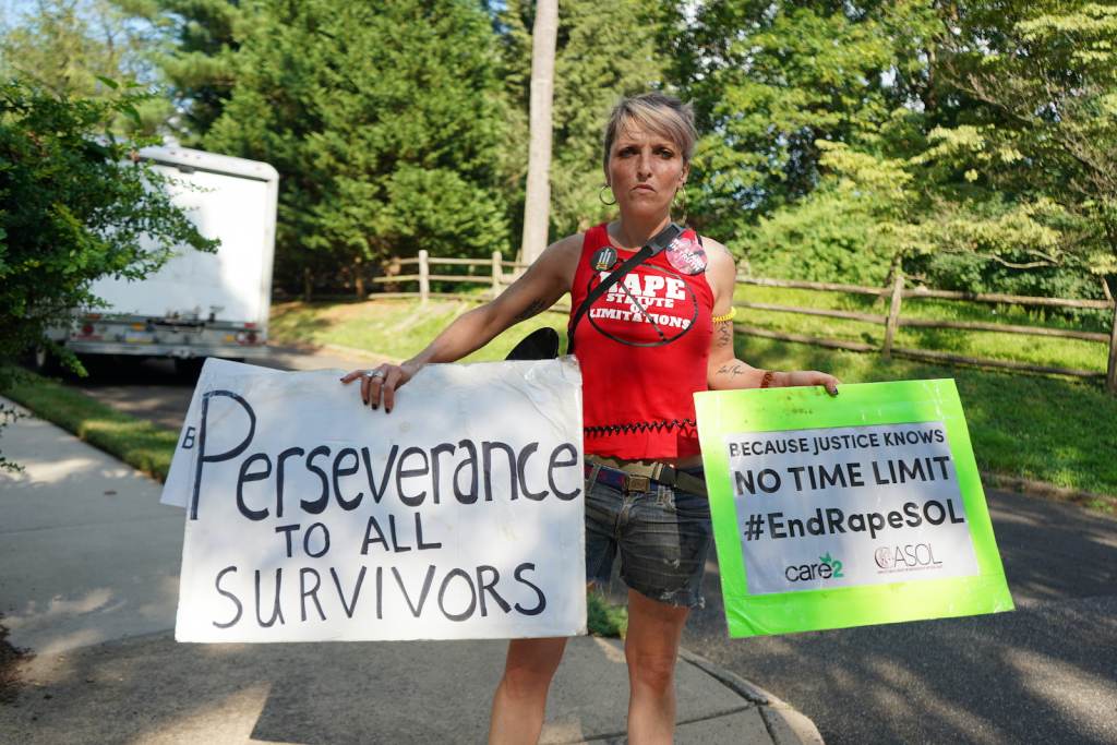 bill_cosby_freed_protest_070121 A protester outside Bill Cosby's Elkins Park, Pa., home holds a sign that reads,