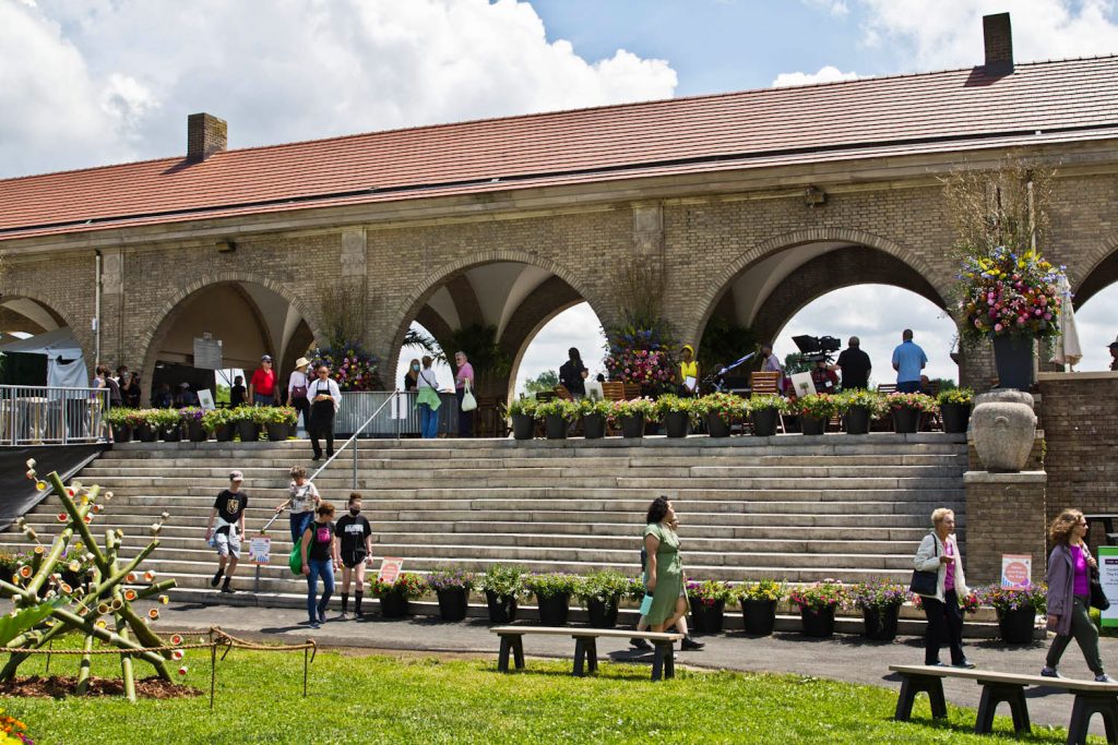 flowershow-fdrpark Visitors mill about The Boathouse at FDR Park