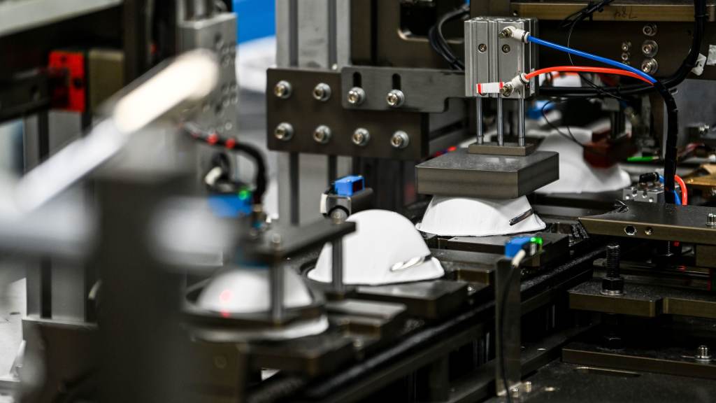 A machine makes masks in a medical-equipment factory in the U.S. on Feb. 15. When an N95 respirator shortage left hospitals scrambling in 2020, U.S. manufacturers stepped in. Now, some of those companies are struggling to sell their masks.