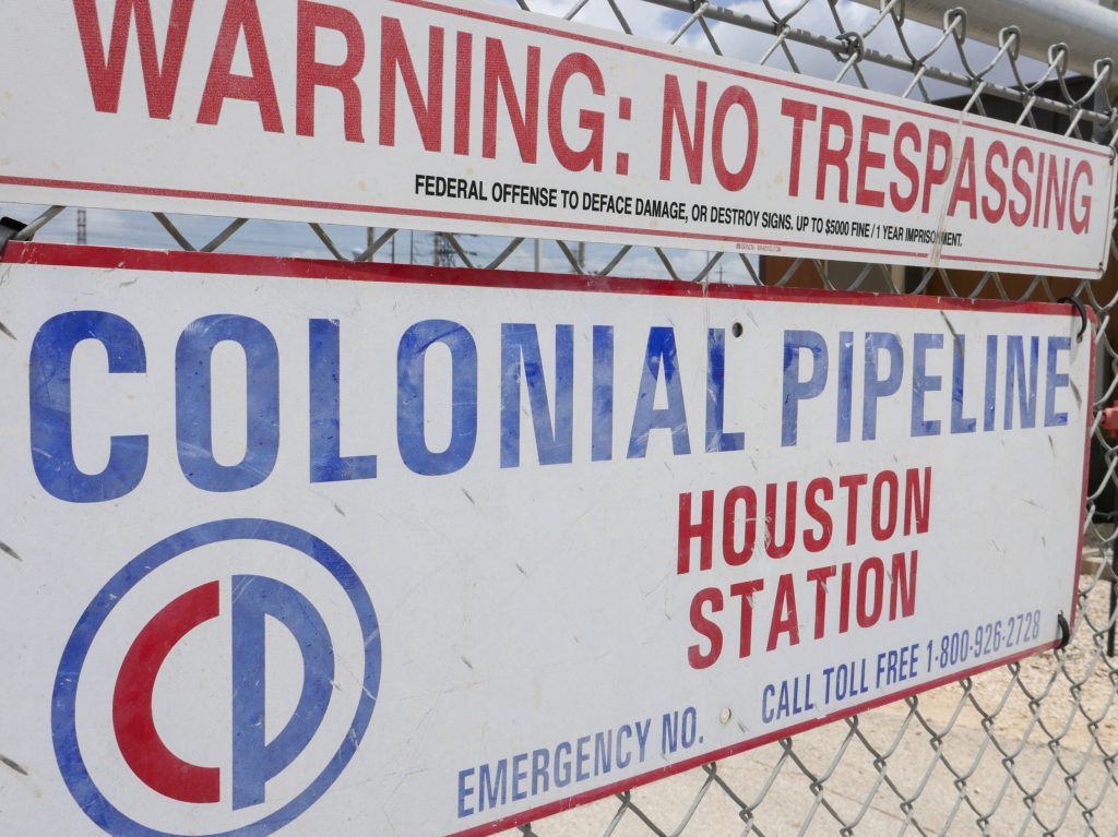A sign at the Colonial Pipeline Houston Station facility in Pasadena, Texas, warns against trespassing. Colonial was forced to shut down a key pipeline last month after suffering a ransomware attack. Such attacks are becoming more frequent and increasingly, they are targeting key infrastructure like fuel or food supplies. Image showing the Colonial Pipeline Houston Station facility in Pasadena