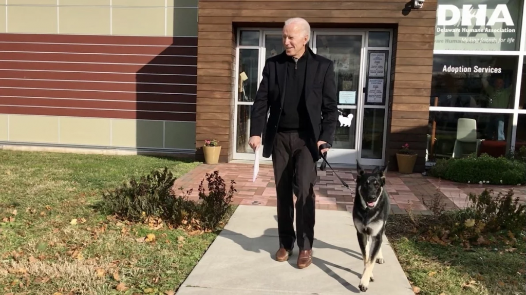 Joe Biden exits the Delaware Humane Association with his dog Major