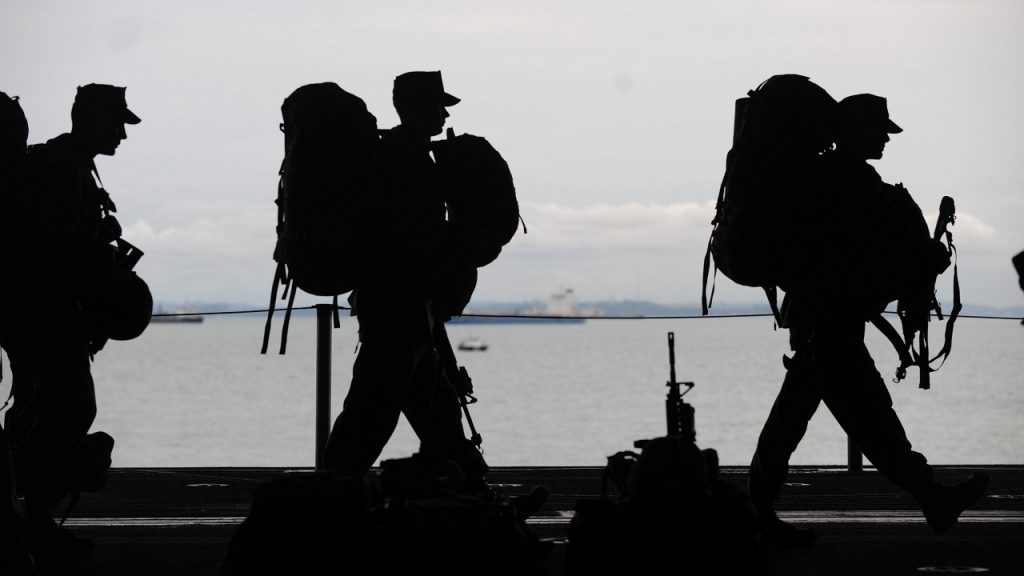 military_generic_01_pexels The silhouettes of military service members are pictured.
