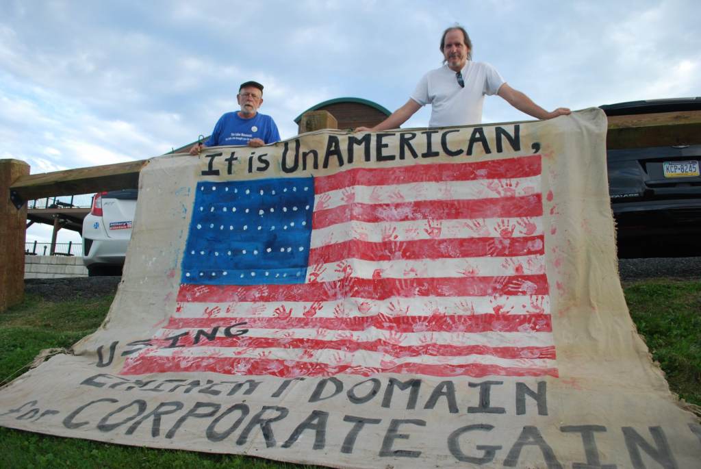 penneast-and-others-194-1920×1285 Roy Christman (left) and William Kellner, protested plans to build the PennEast natural gas pipeline at a FERC 'listening session' near Jim Thorpe, Pa. in 2016. FERC has now approved the project. (Jon Hurdle / StateImpact PA)