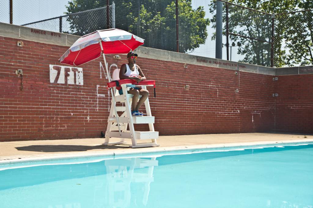 phillypools-lifeguards-03 Breana Cooper on watch from the lifeguard stand